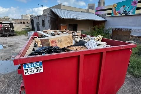 Dumpster on a commercial job site cleanup